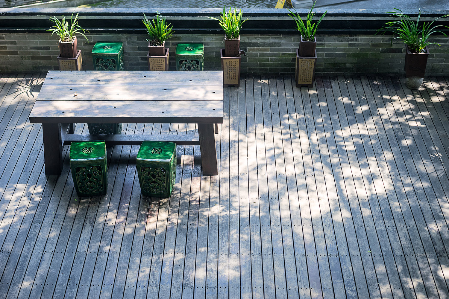 chairs and a table in a small wood platform